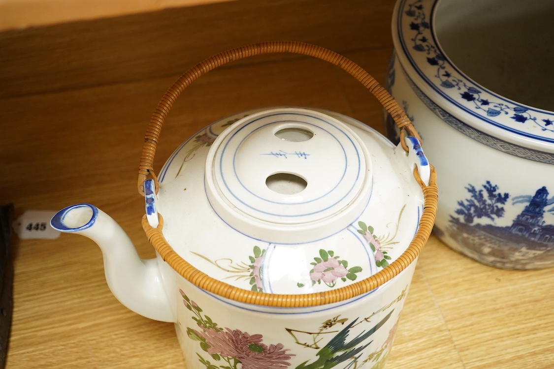 A pair of Chinese large scale teapots and a European blue and white planter, 22.5cm